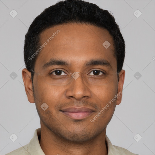 Joyful black young-adult male with short  brown hair and brown eyes