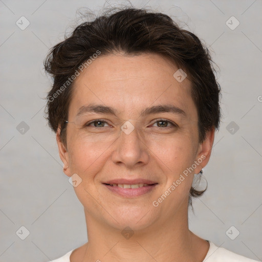 Joyful white adult female with short  brown hair and brown eyes