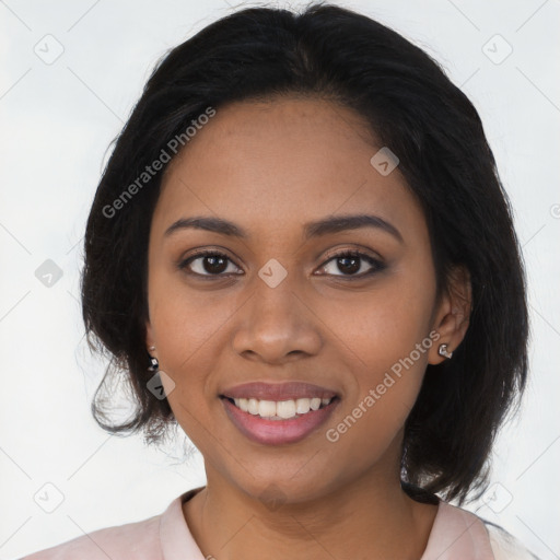 Joyful black young-adult female with medium  brown hair and brown eyes