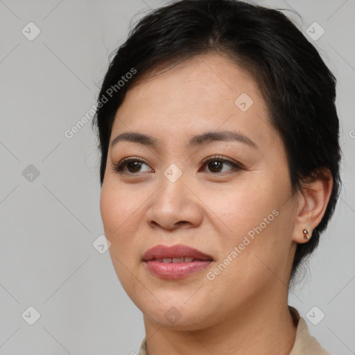 Joyful asian young-adult female with medium  brown hair and brown eyes