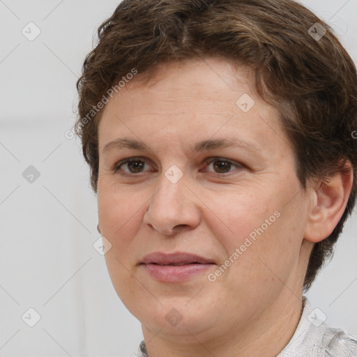 Joyful white adult female with short  brown hair and brown eyes