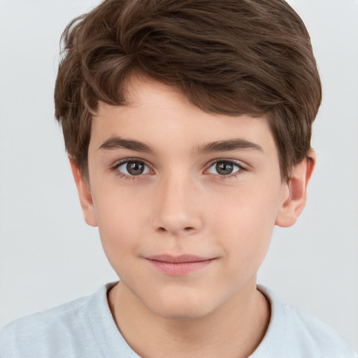 Joyful white child male with short  brown hair and brown eyes