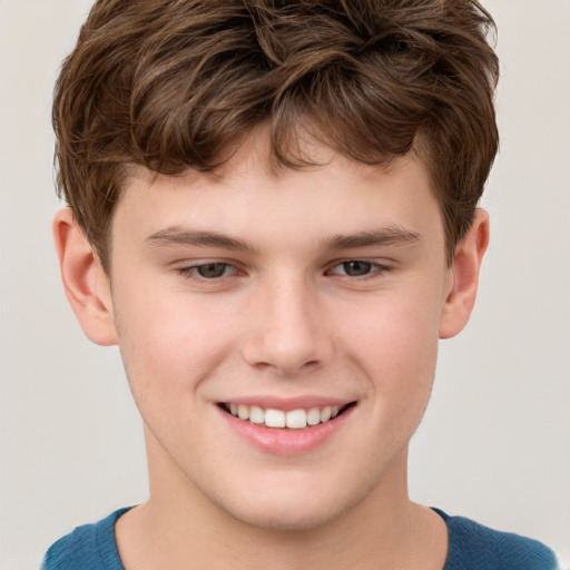 Joyful white child male with short  brown hair and brown eyes