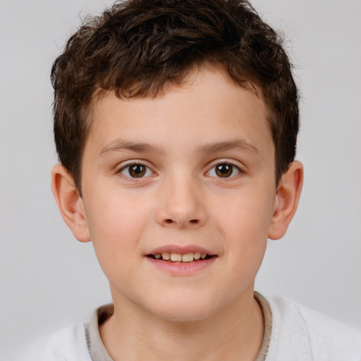 Joyful white child male with short  brown hair and brown eyes