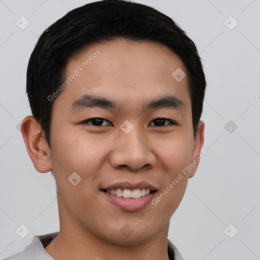 Joyful asian young-adult male with short  black hair and brown eyes