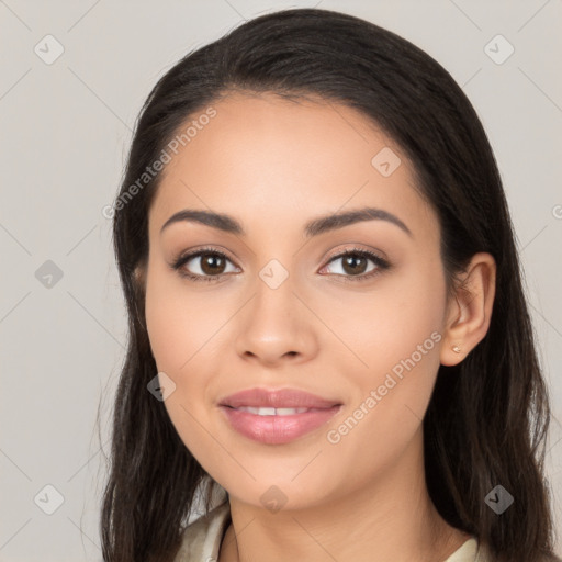 Joyful latino young-adult female with long  brown hair and brown eyes