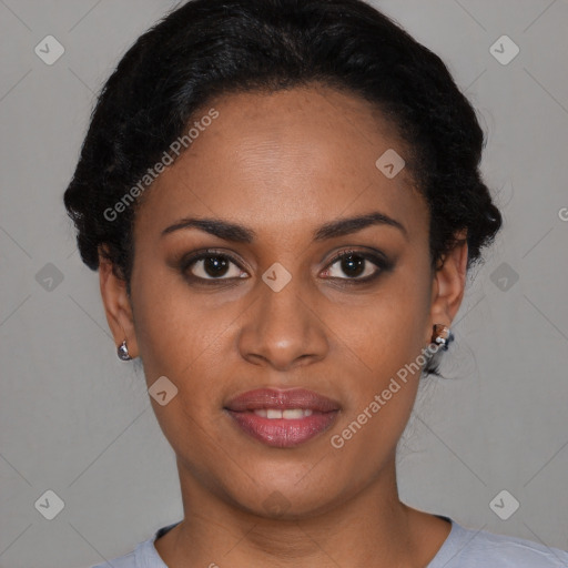 Joyful black young-adult female with short  black hair and brown eyes