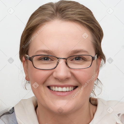 Joyful white adult female with medium  brown hair and blue eyes