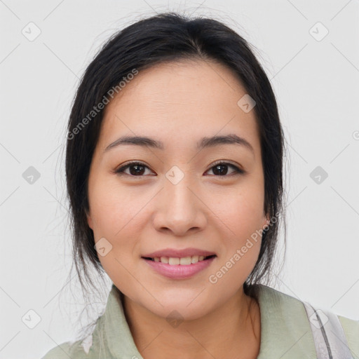 Joyful asian young-adult female with medium  brown hair and brown eyes