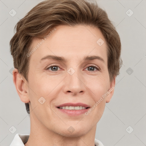 Joyful white adult female with short  brown hair and grey eyes