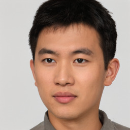 Neutral asian young-adult male with short  brown hair and brown eyes