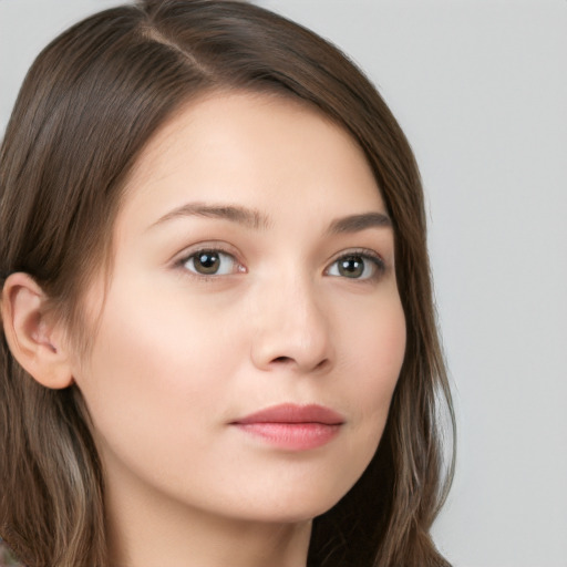 Neutral white young-adult female with long  brown hair and brown eyes