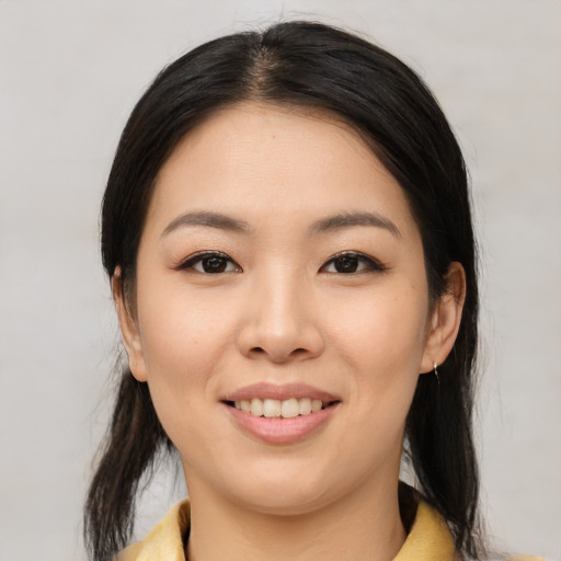 Joyful white young-adult female with medium  brown hair and brown eyes