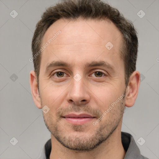 Joyful white adult male with short  brown hair and brown eyes