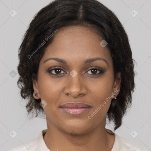Joyful black young-adult female with medium  brown hair and brown eyes