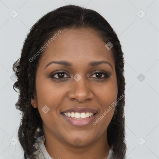 Joyful black young-adult female with long  brown hair and brown eyes