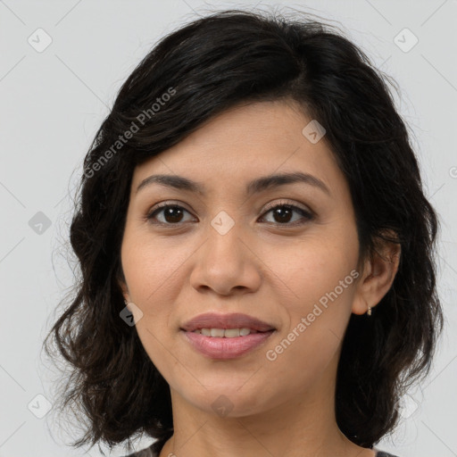 Joyful latino young-adult female with medium  brown hair and brown eyes