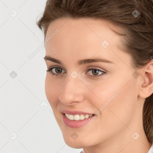 Joyful white young-adult female with medium  brown hair and green eyes