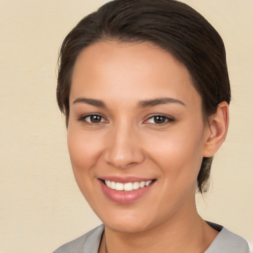 Joyful white young-adult female with medium  brown hair and brown eyes