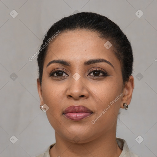 Joyful latino young-adult female with short  brown hair and brown eyes