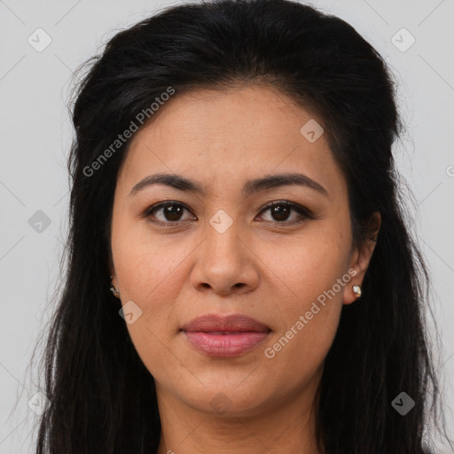 Joyful latino young-adult female with long  brown hair and brown eyes