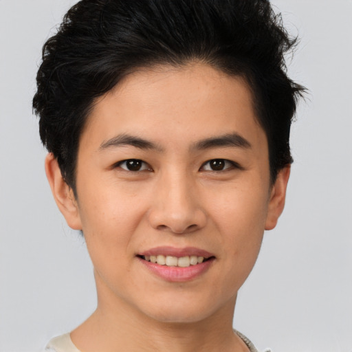Joyful asian young-adult female with short  brown hair and brown eyes