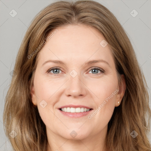 Joyful white young-adult female with long  brown hair and grey eyes