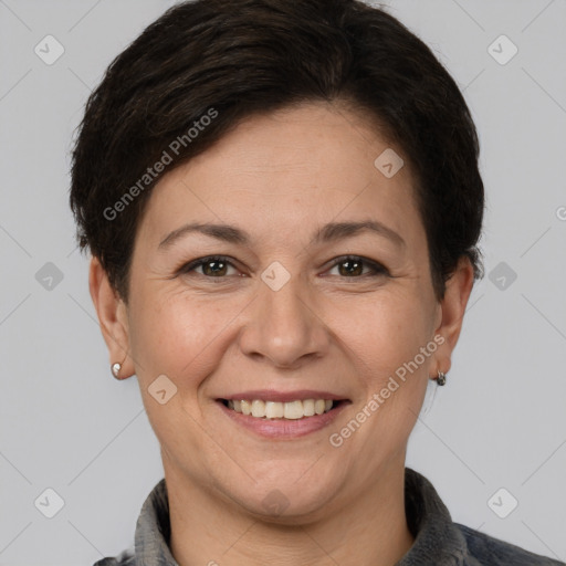 Joyful white adult female with short  brown hair and brown eyes