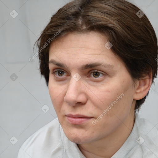 Joyful white adult female with short  brown hair and brown eyes