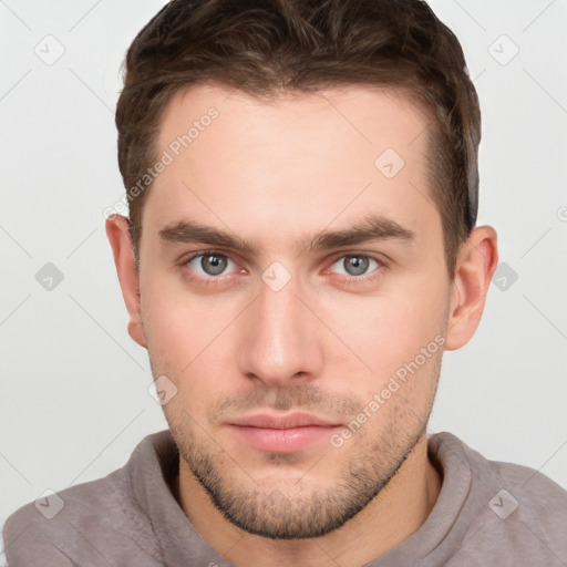 Neutral white young-adult male with short  brown hair and grey eyes