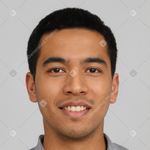 Joyful latino young-adult male with short  black hair and brown eyes