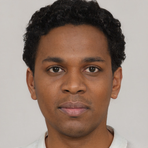 Neutral black young-adult male with short  brown hair and brown eyes