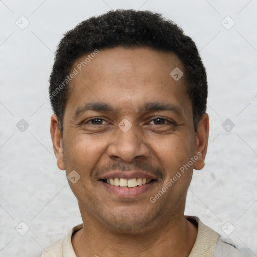 Joyful latino young-adult male with short  brown hair and brown eyes