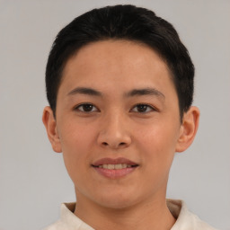 Joyful asian young-adult male with short  black hair and brown eyes