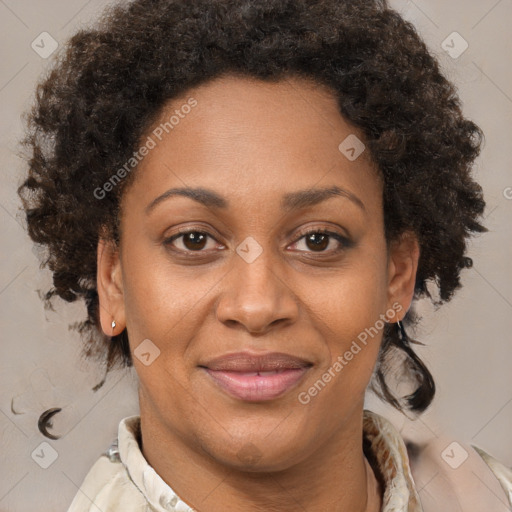 Joyful black adult female with medium  brown hair and brown eyes