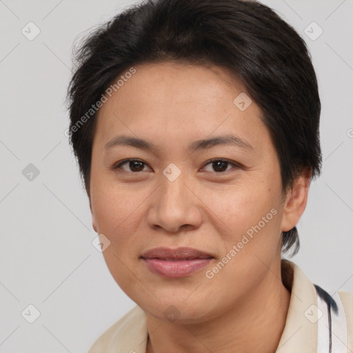 Joyful white adult female with short  brown hair and brown eyes