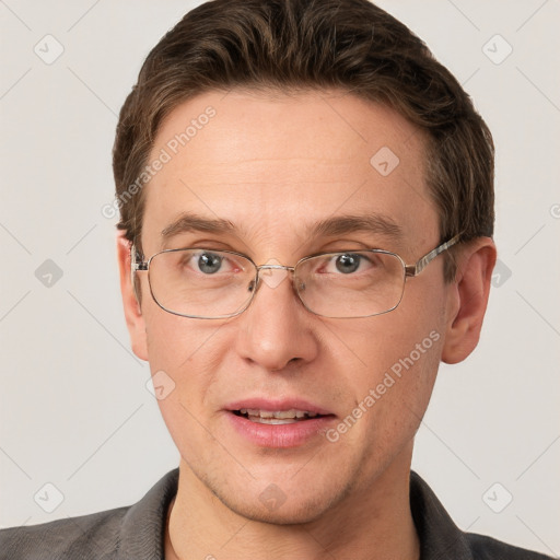 Joyful white adult male with short  brown hair and grey eyes