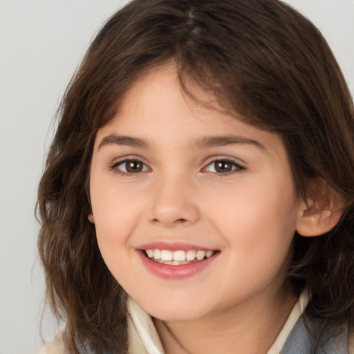 Joyful white child female with medium  brown hair and brown eyes