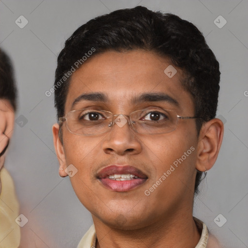 Joyful black young-adult male with short  brown hair and brown eyes