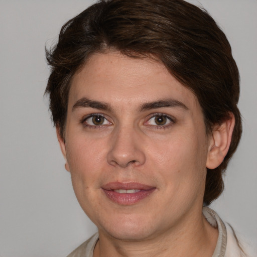 Joyful white young-adult female with medium  brown hair and brown eyes