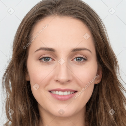 Joyful white young-adult female with long  brown hair and grey eyes