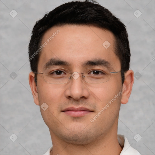 Joyful white young-adult male with short  black hair and brown eyes