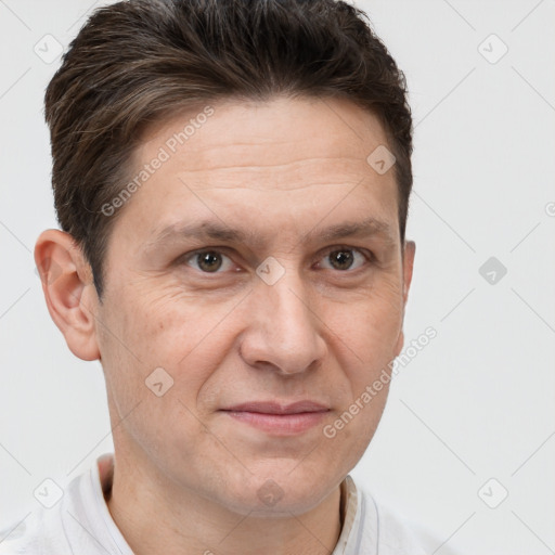 Joyful white adult male with short  brown hair and brown eyes