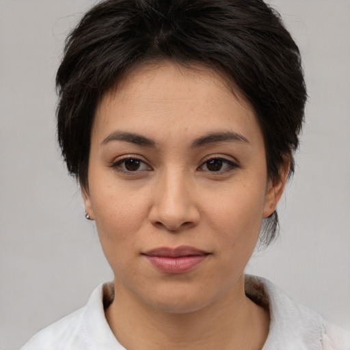 Joyful asian young-adult female with short  brown hair and brown eyes