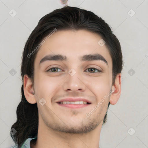 Joyful white young-adult male with short  black hair and brown eyes