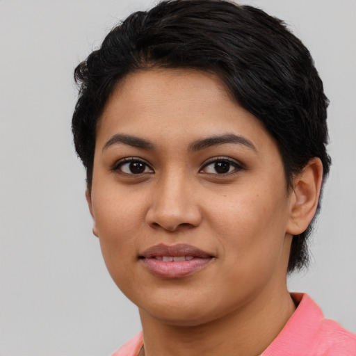 Joyful asian young-adult female with short  black hair and brown eyes