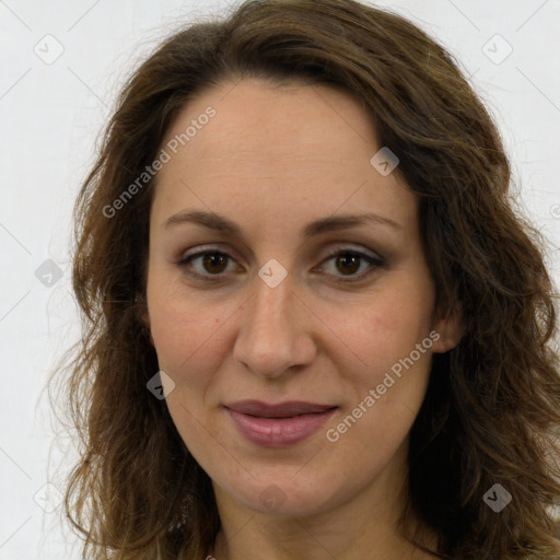 Joyful white adult female with long  brown hair and brown eyes