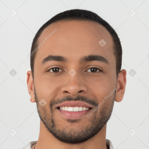 Joyful latino young-adult male with short  black hair and brown eyes