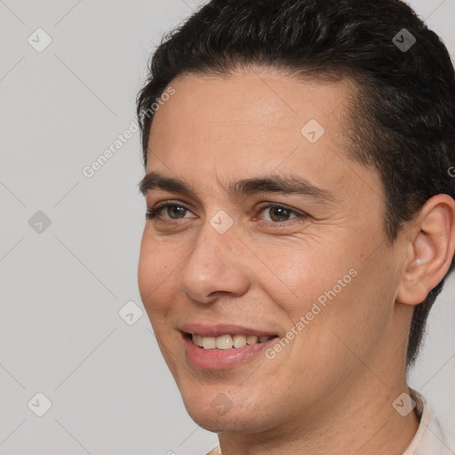 Joyful white young-adult male with short  brown hair and brown eyes