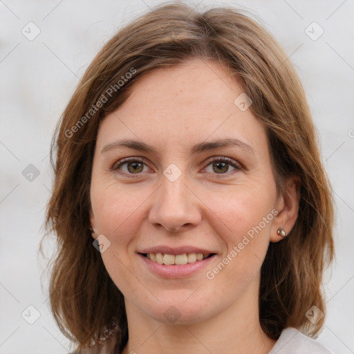 Joyful white young-adult female with medium  brown hair and green eyes